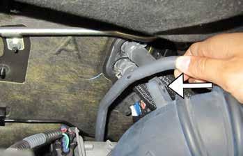 Carefully disconnect the inlet tube from the throttle body, ensuring the tube