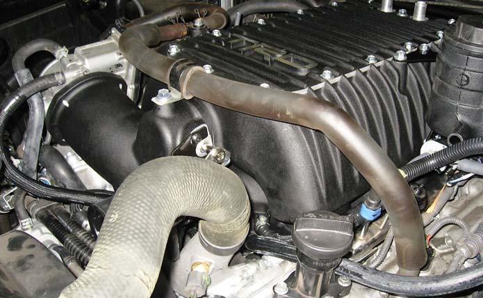 25. Install the Vent Hoses. T Long hose original configuration (a) The ventilation hose assembly is shown as removed from the intake manifold (Fig. 25-1). Middle hose Fig. 25-1 Fig. 25-2 Fig.