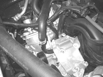 Remove the alternator and set it aside. 12.