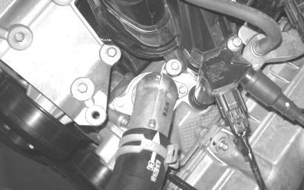 13. Remove the two bolts securing the thermostat housing inlet and undo the upper