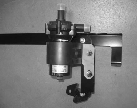 Loosely install the Lower RH LTR Mounting Bracket (1111-8K245) to the lower RH corner of the I/C Pump Mounting bracket as shown, using one M8 x 25 bolt (N808920) from