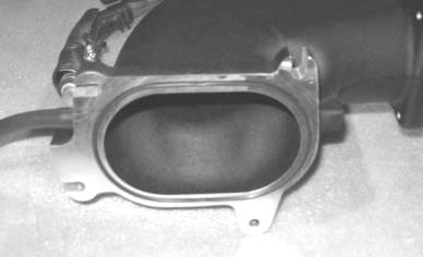5. Insert the supercharger to throttle body spacer gasket (R07060152) into
