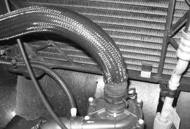 3. Secure one end of the hose to the bottom of the degas bottle and the opposite end to the inlet on the pump using one (1) ¾ constant