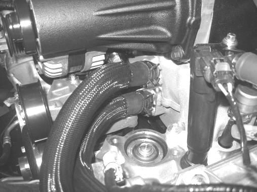 29. Connect the Intercooler LTR Outlet hose (1111-8D030) to the lower turret on the intake manifold. Secure the hose using one (1) ¾ constant tension clamp from Hardware Kit D.
