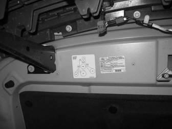 9. The Belt Routing Diagram (1162-6E072) is to be placed on the underside of the hood, on the passenger side, beside
