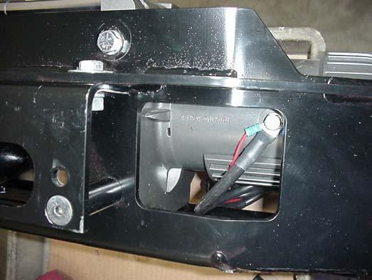 Place the Control Pack in the Control Pack Bracket with the cables exiting toward the winch. Figure 4 shows which mounting holes to use. Use the 1/4 nut/washers to secure the Control Pack.