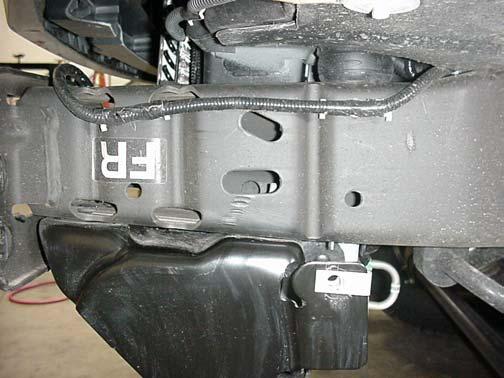 Tighten the factory fasteners. 6. Insert the 5/8 x 2 bolts through the Outer Brackets and the upper rear hole in the Bumper Brackets through the diagonal slot in the frame.