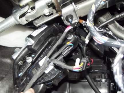Step 2: Unplug the wiring harness from the pedal position sensor.