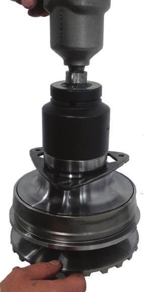 Nissan F10 Series Primary Pulley Using an impact gun and a large socket, remove the nut.