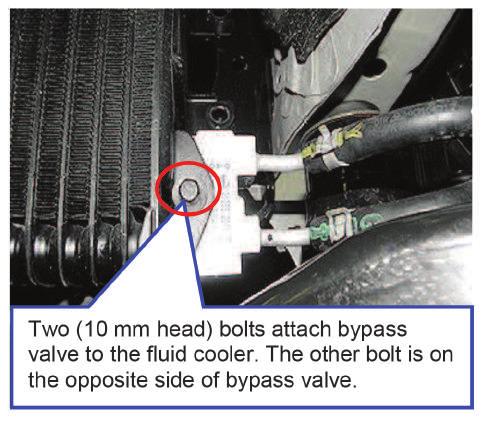 3. Place an oil drain pan under the CVT fluid cooler. 4. Unbolt and disconnect the external CVT fluid cooler bypass valve from the external CVT fluid cooler as shown. (Figure 1) 5.