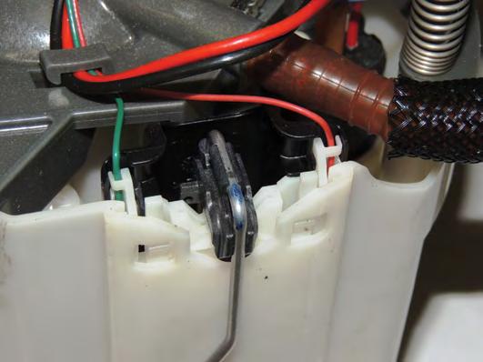 NOTE: Be sure the rubber seal stays with the black connector during removal and