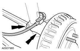 8. Partially lower the vehicle. 9. Remove the nuts and the strut and spring assembly. Discard the nuts. Installation 1.