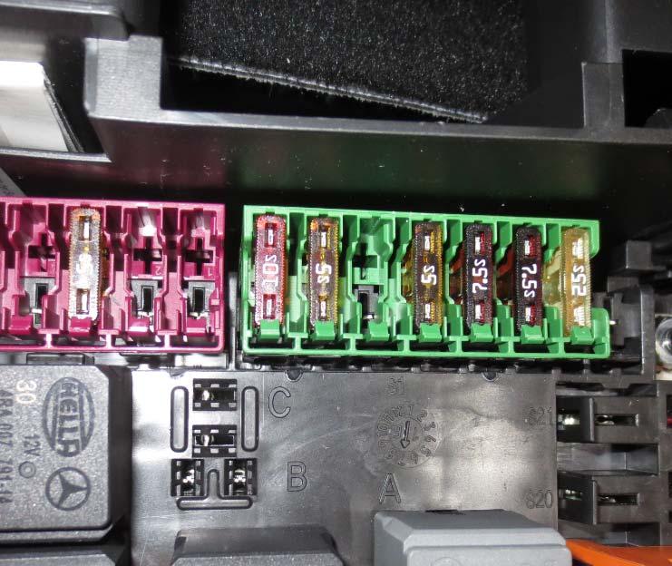 - Attach the power supply connector to a free port of the green fuse panel and attach the fuse
