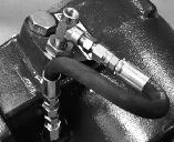 Locate the lube hose, hose fittings, 43M02203 straight orifice fitting and street tee (Fig. 4). Install PTO onto the transmission.