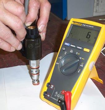 CHECK CARTRIDGE VALVE SOLENOIDS (The cable is plugged into the hammer) Method: All that can be done with the hammer on the ground is to check the continuity of the solenoids.