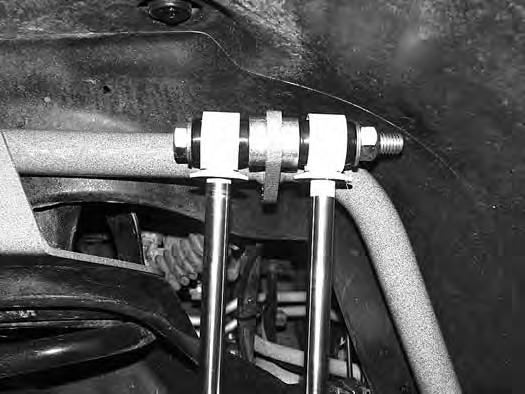 FIGURE 10 23. Attach shock lower mounting point the same as above. Run bolt from back to front. (Fig 10/11).