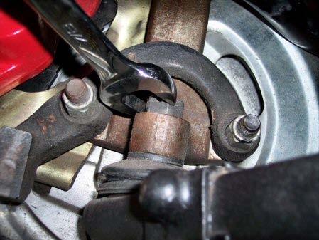 Allow the tie rod to hang down. 7.