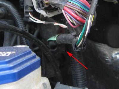 Remove the two push pin wire ties (one on either side of the bracket)