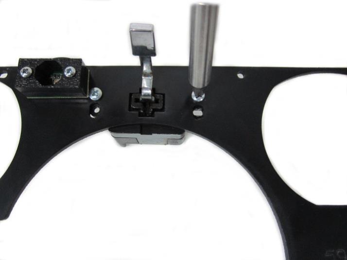 The Wiper switch will fit into the large cross hair, and the arm of the switch will slide through the ABS