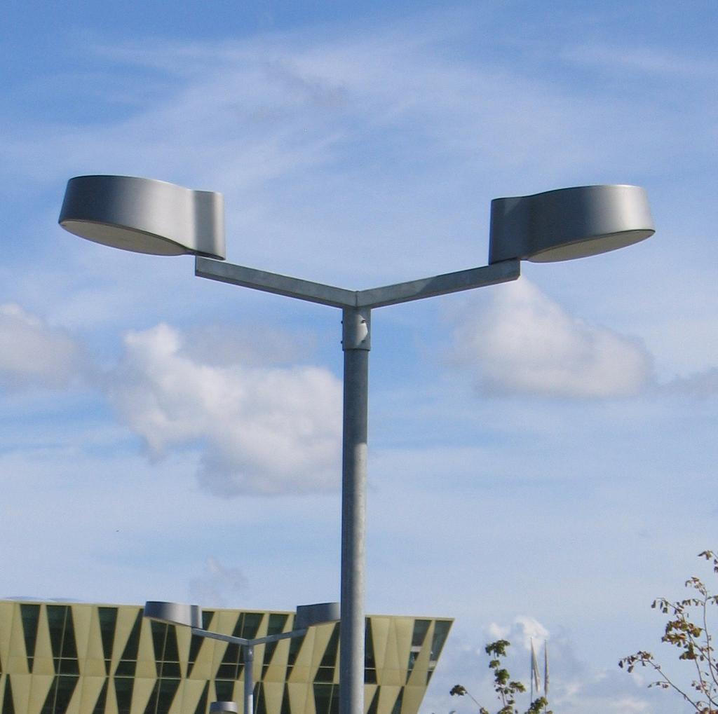 Made of cast silumin with clear or opal-white polycarbonate screens, the luminaires are simple and safe and do not invite to vandalism. The NYX luminaires use LED, CFL or metal halide lamps.