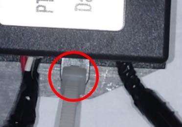 NOTE: Ensure the wire tire lock points towards the module or front of the