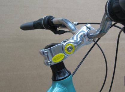 To position the handlebar this way, loosen the handlebar clamp bolts enough to rotate the handlebar (2-A).