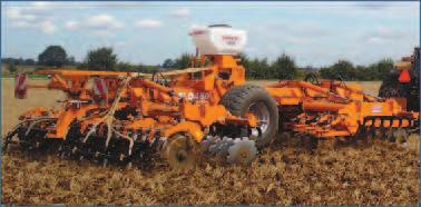 Product is metered by the feed rolls down individual delivery tubes to the spreader kit.