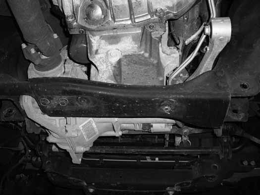 27. Remove the four bolts mounting the rear crossmember to the rear lower control arm pockets (Figure 14). Remove the crossmember from the vehicle. The crossmember and hardware will not be reused.