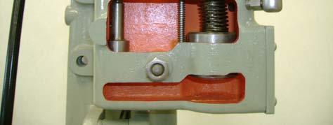 The small dashpot plunger via a linkage is connected directly to the governor pilot valve.