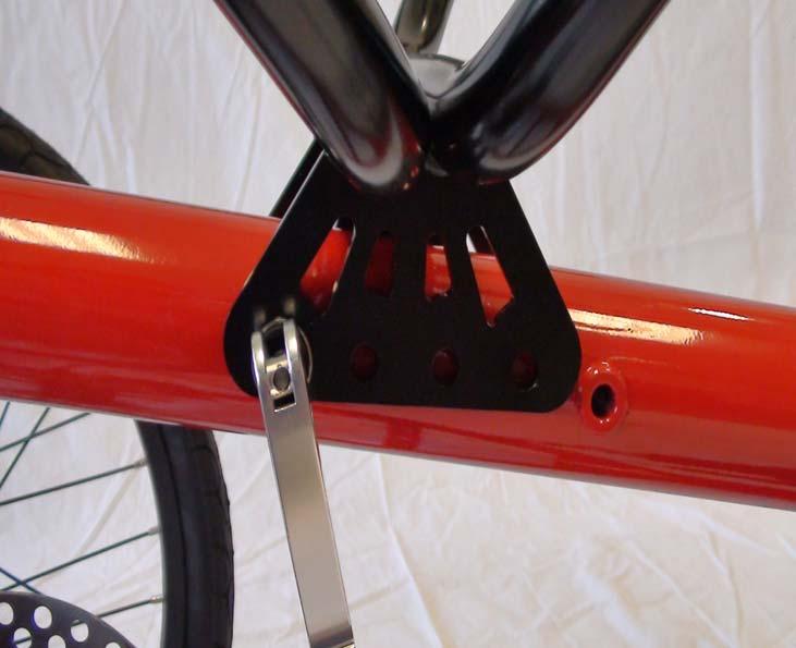 1) Place main seat frame mounting bracket over main frame so that one hole in the seat bracket aligns with