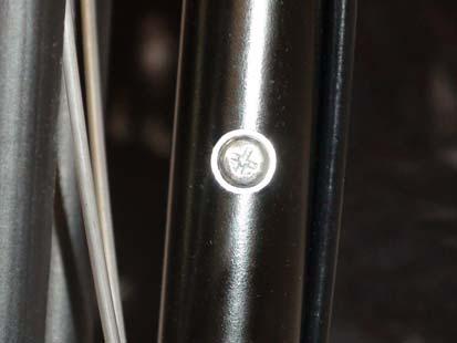 1) Remove the Phillips head screw located on the steering stem tube.