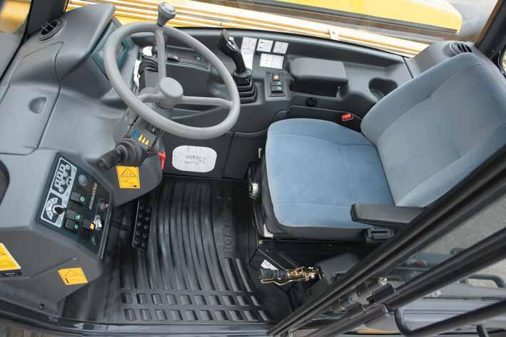 Total Comfort Automotive style interior The ROPS/FOPS cab has a modern and ergonomic layout.