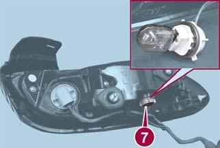 5. Turn the socket and bulb assembly counterclockwise to remove from taillight housing, and remove bulb. Reverse Light Proceed as follows: 1.