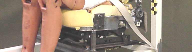 Prototypes of the TTC were fabricated and tested with a seated dummy occupant. A 5 th percentile Hybrid III male dummy was chosen for testing on a surrogate driver s side seat.