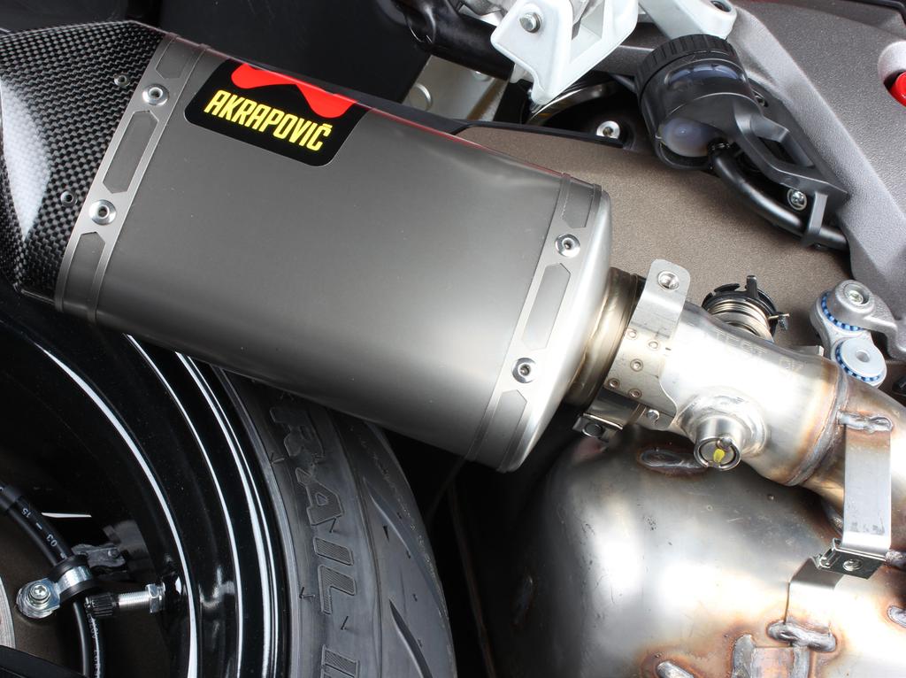 4. Slide the muffler onto the stock collector, and rotate