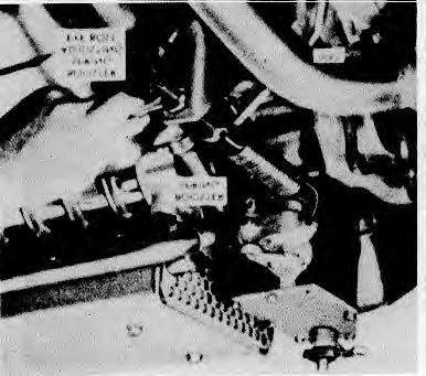 Engine Tune-Up Fig. 9 - Adjusting Booster Spring retaining nut on the speed control lever. Loosen the lock nuts on the eye bolt at the opposite end of the booster spring. 3.
