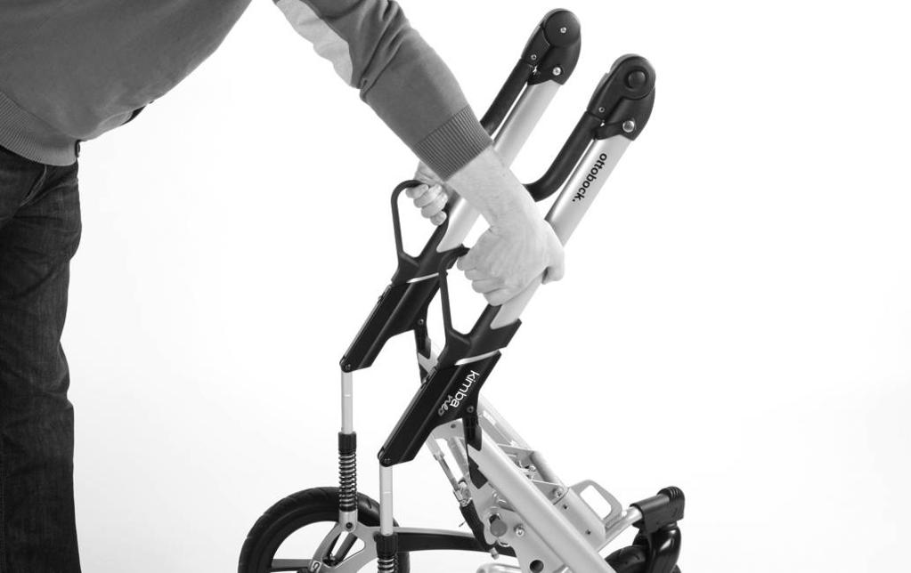The rehab buggy must be prepared for transport in a car: 1) Pull up the release handles of the folding mechanism (see fig. 57).