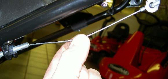 Adjust the cable so that there is only about 10mm sideways free play in the inner cable leading to the bail arm, then fully tighten the two adjuster nuts.
