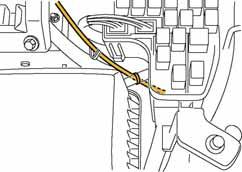 Route the hood switch harness along the vehicle wiring harness and secure it using a tie wrap (lack) at one location. Pass behind vehicle wiring harness.