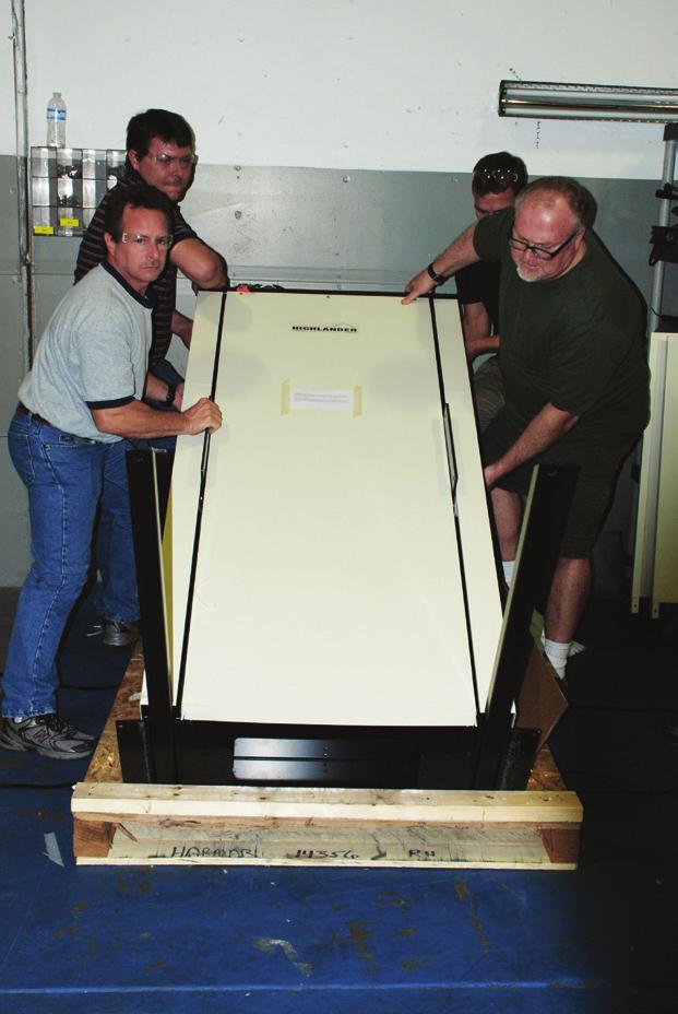 Grasp the loose panel by its sides and raise it up and slide it to the side, freeing it from the lift frame.