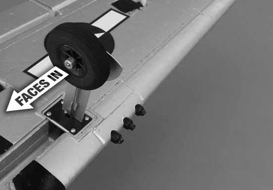 Position the flap so that it is aligned with the trailing edge of the wing and tighten the screw in the quick connector against the flap pushrod. Repeat for the other flap servo and linkage.