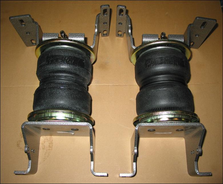 PRE ASSEMBLY OF THE AIR SPRINGS Refer to Figure 1, and use the following steps to preassemble the air springs 1 Place roll plates (2) on the ends of each air spring (1).
