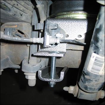 Mount the adel clamp to the air bag bracket (inboard slot where U-bolt would have been) using a /8 hex cap screw (9), /8 washer