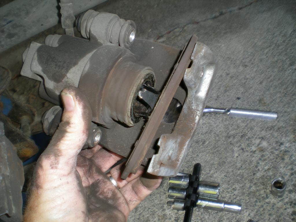 At some point, remove the inner brake pad. It just pops out since it is held in place by a tension spring.