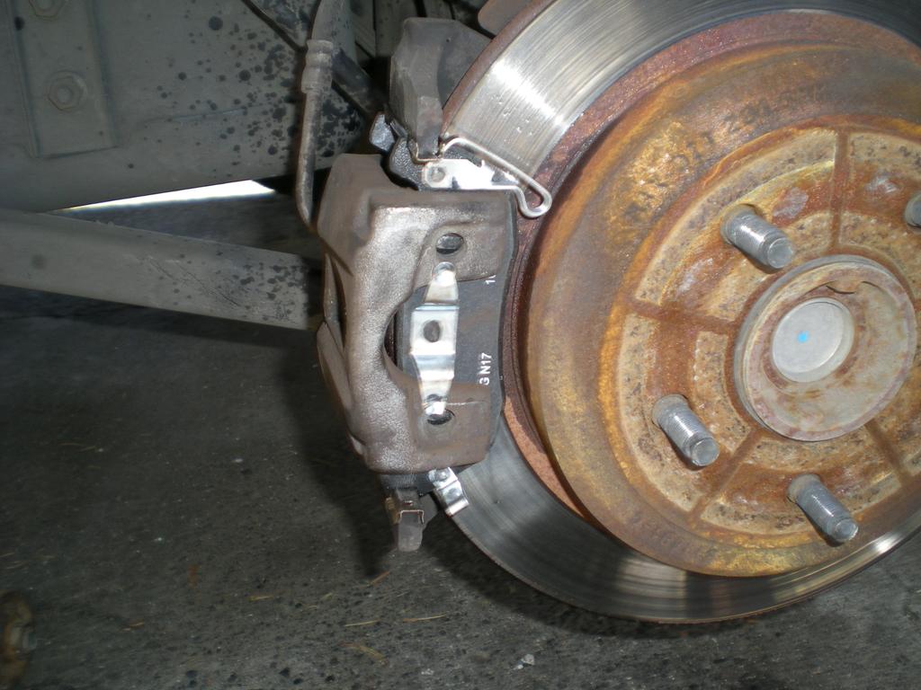 Attach the bottom of the caliper first and then tip it into place using as little force as possible.