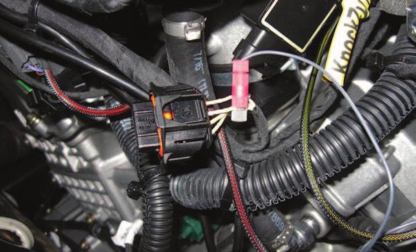16 Plug the ORANGE colored wires of the PCV in-line of the stock wiring harness and injector. FIG.