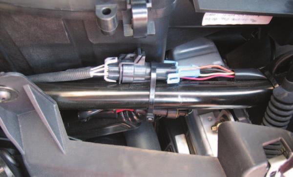 FIG.Q 26 Unplug the stock wiring harness from the rear O2 sensor (Fig. Q). This connection is located on the right side of the vehicle between the air box and the frame rail.