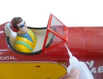 If you are going to install a pilot figure, please use a sanding bar to sand the base of the figure so that it is flat. 3) Position the pilot figure on the cockpit floor as shown.