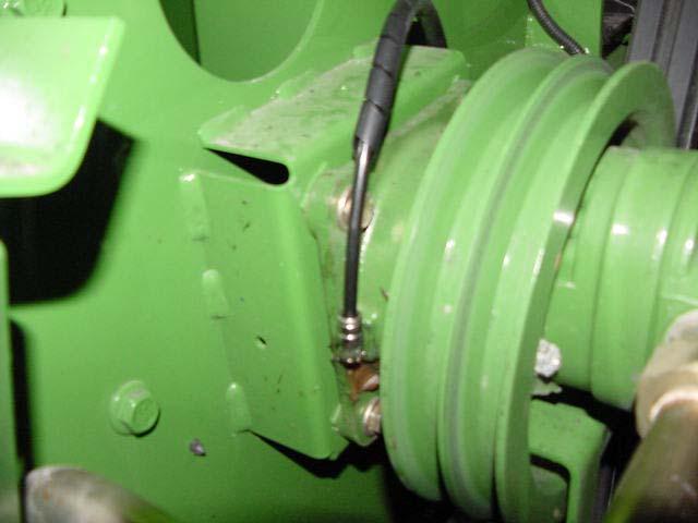 Install one 244054 fitting, replacing grease zerk for Reel Drive Pump.