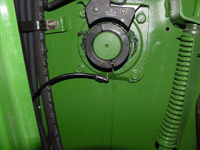 Install one 244054 fitting, replacing grease zerk for Unloader Auger Upper